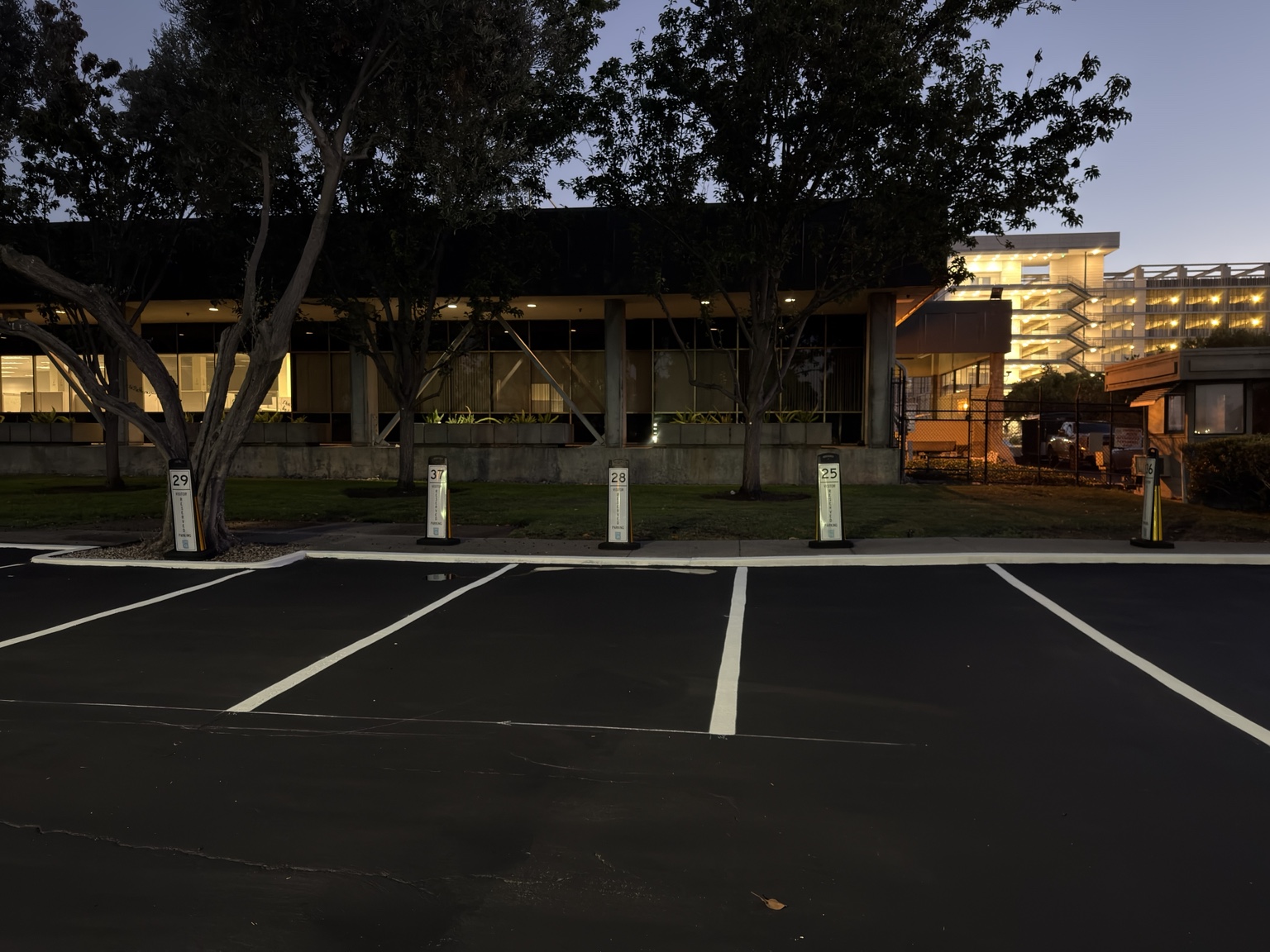 Fresh white parking stall lines at dusk
