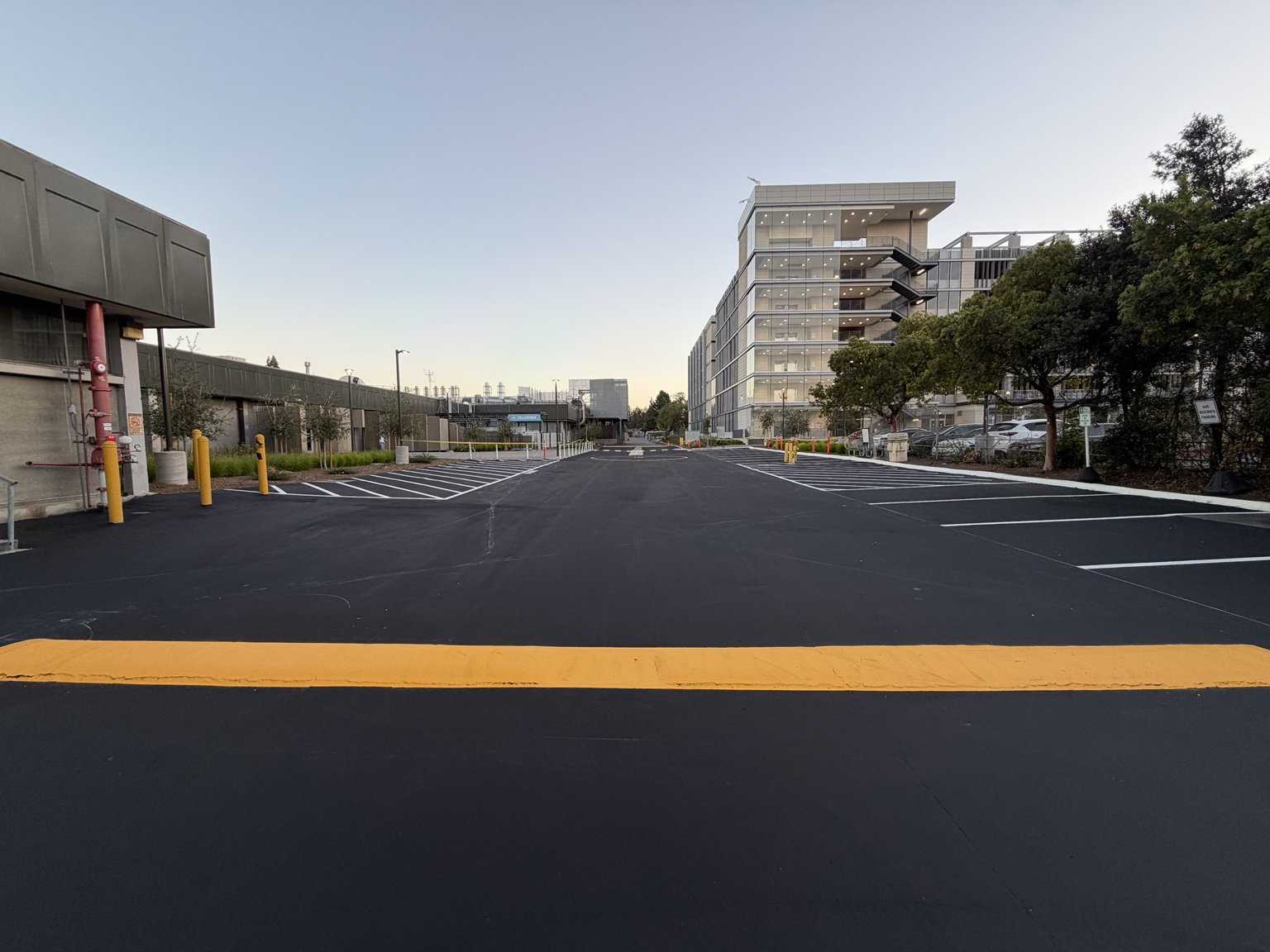 Solid yellow painted speed bump across a drive lane